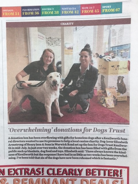 Newspaper clipping of article about donations made to Dogs Trust. Pictured is a Kenilworth funeral director, Dogs Trust employee and a golden Labrador.