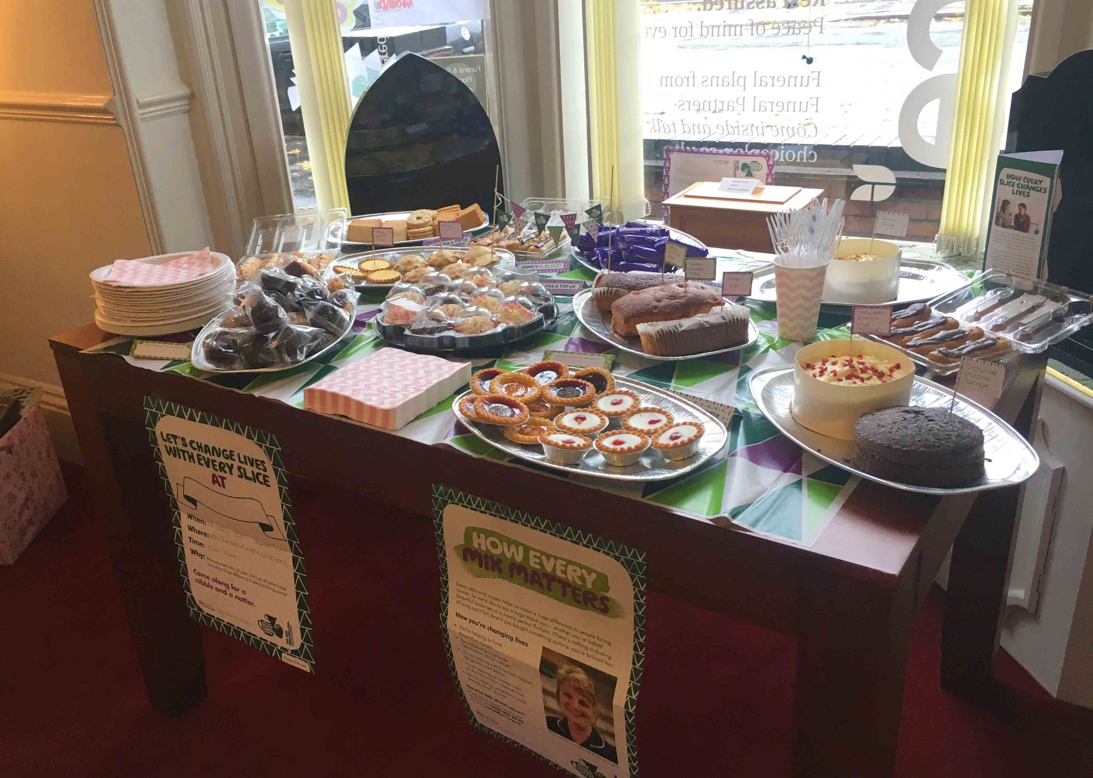Roy Quinton raise a cuppa for Macmillan Funeral Partners