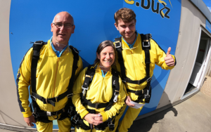 A group of people wearing yellow jumpsuits. Ready for the skydive