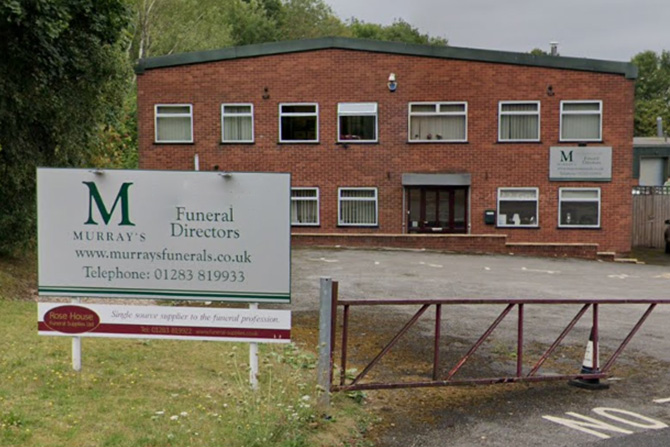Entrance to Murray's Funeral Directors in Swadlincote showing signs and parking area