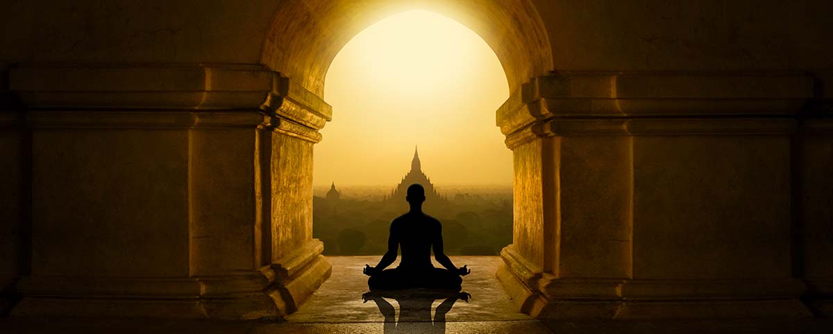 Buddhist monk meditates in a temple